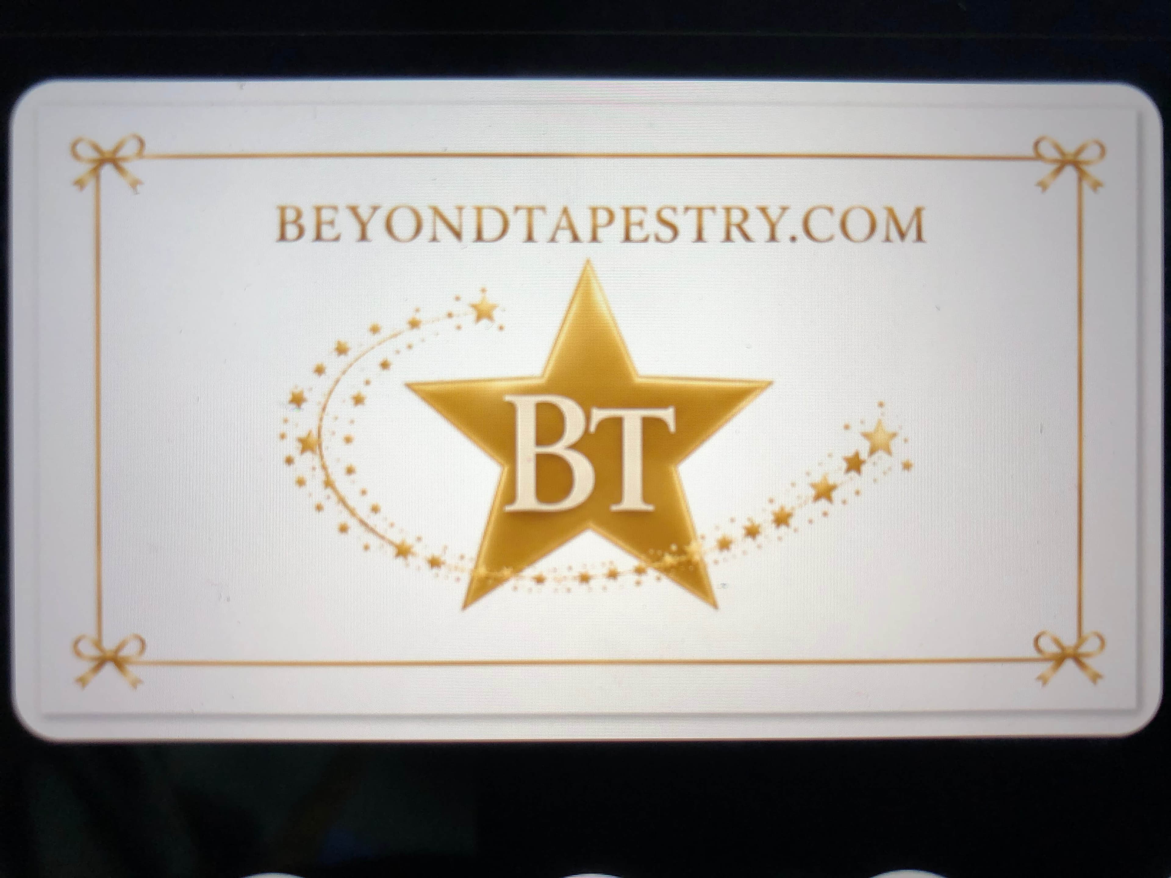 Beyond Tapestry business card with gold star BT mark