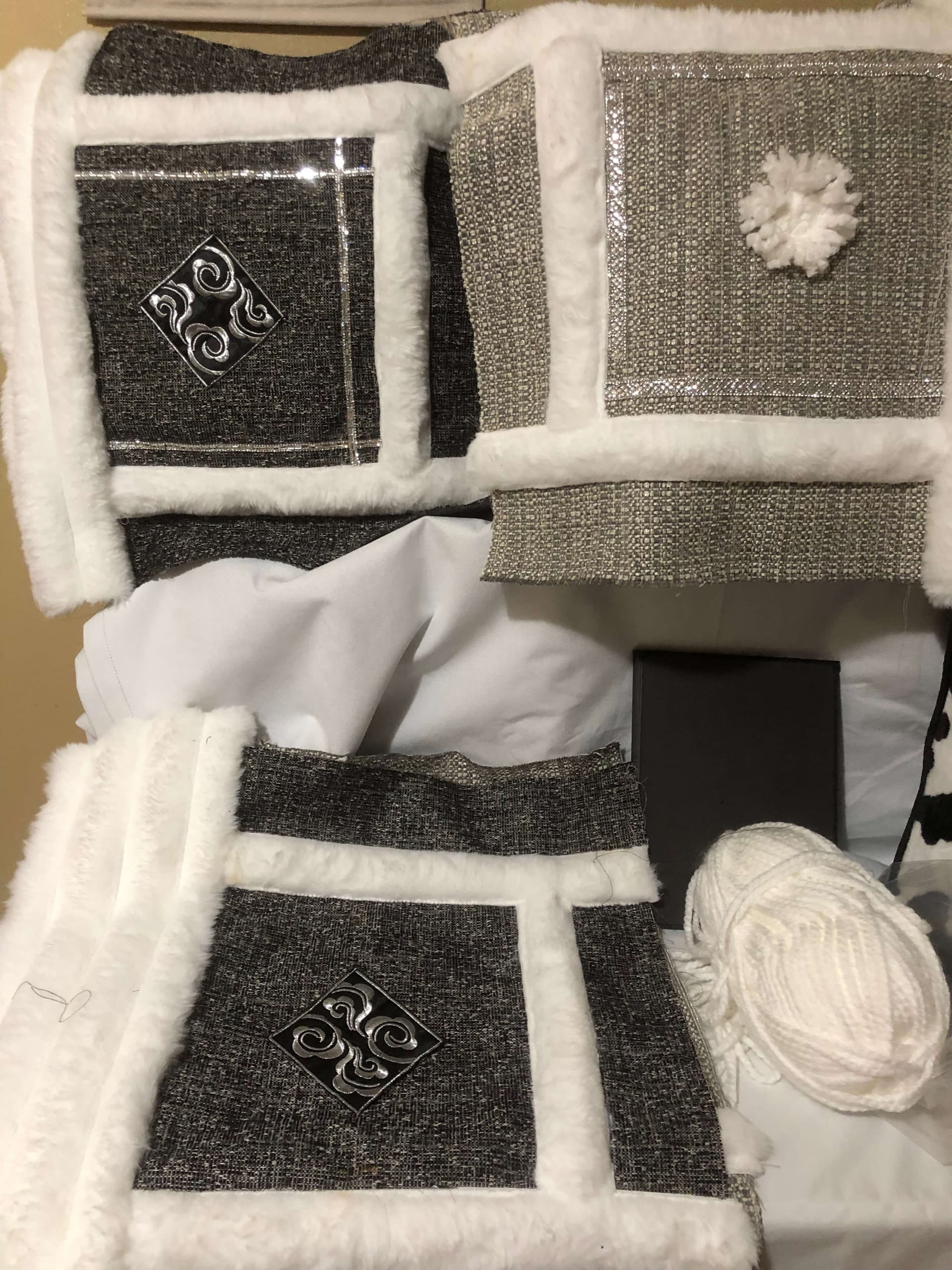 Handmade pillow cover designs with charcoal texture, silver accents, ivory faux-fur trim, and yarn